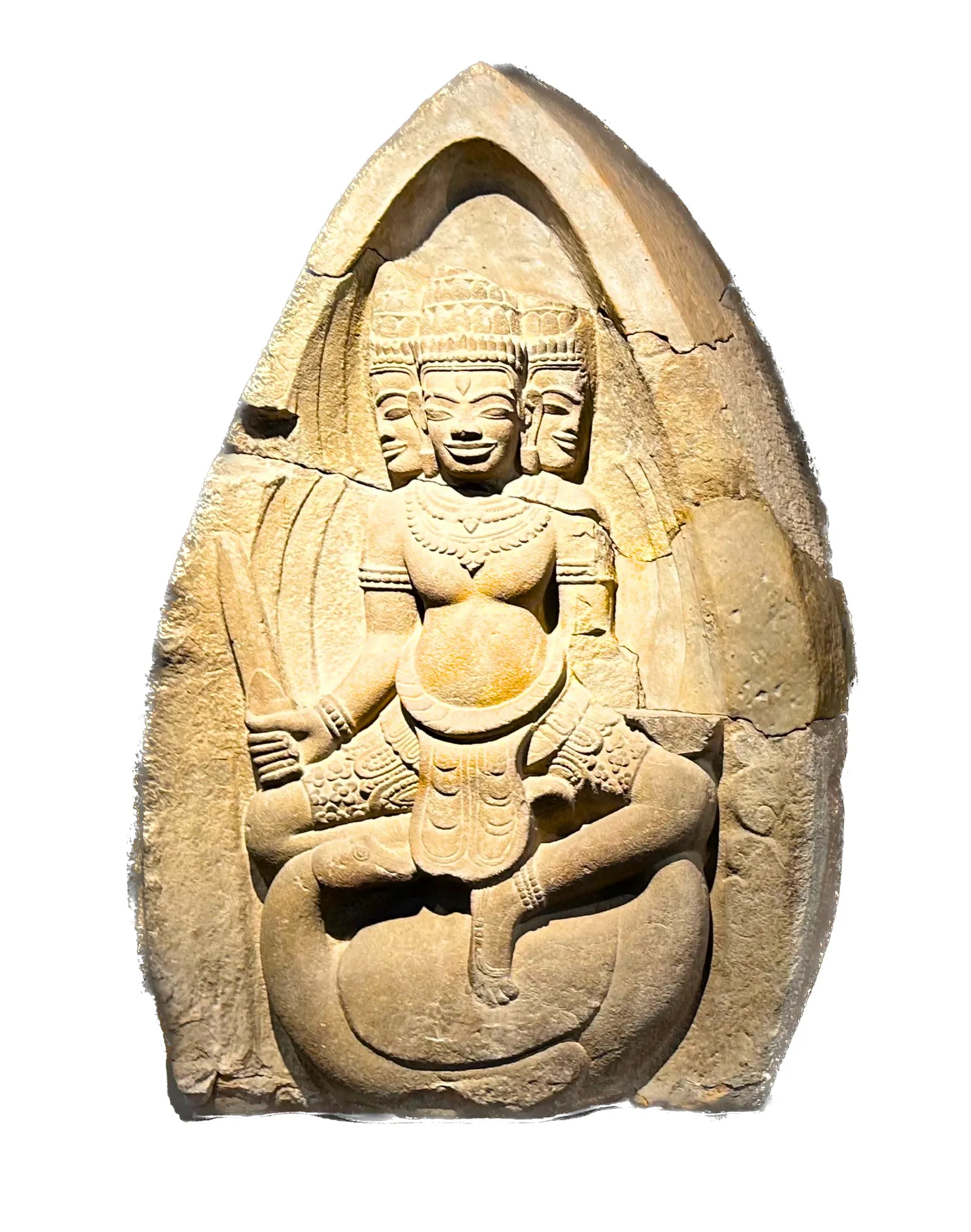 A sandstone relief of the four-faced Hindu god Brahma, seated cross-legged inside a pointed arch, from the Museum of Cham Sculpture's collection.