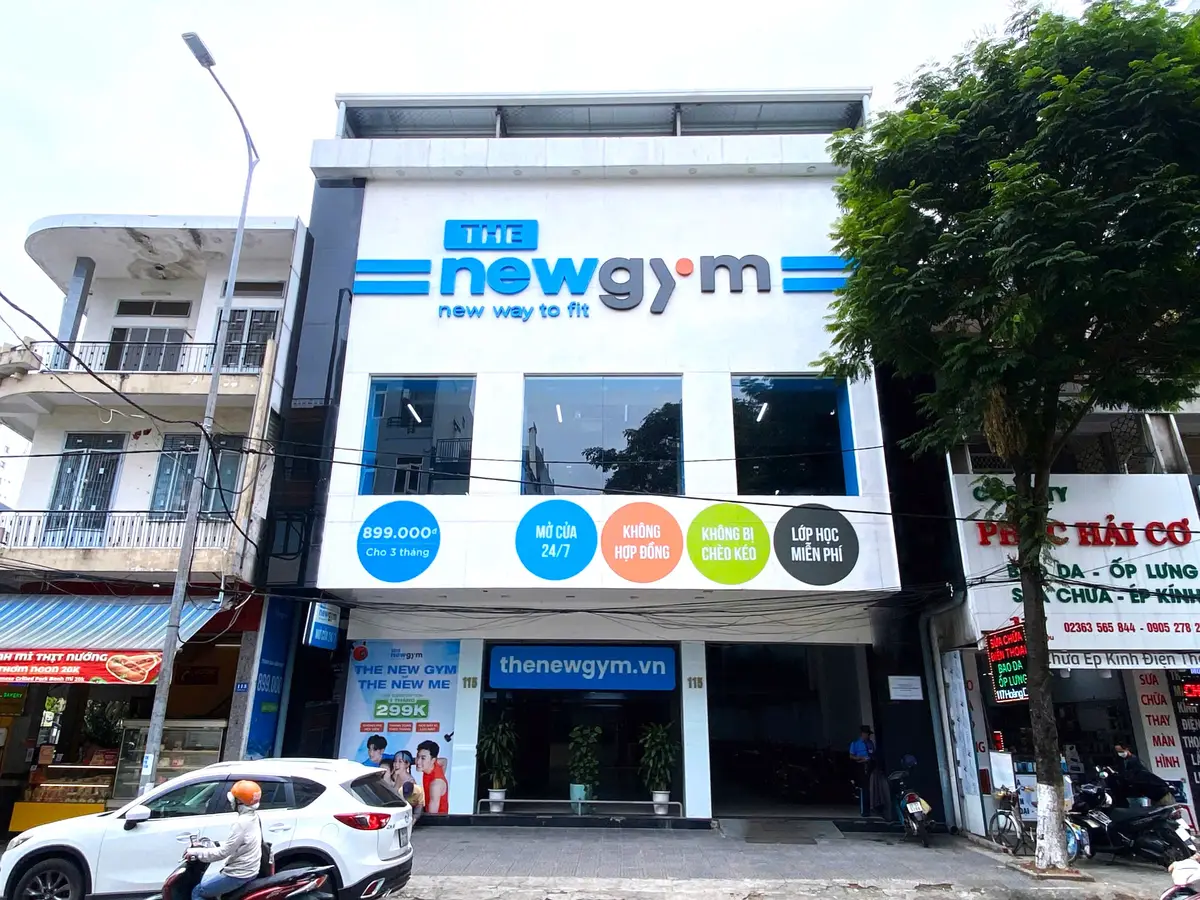 Street frontage of a gym building with a large blue and white sign