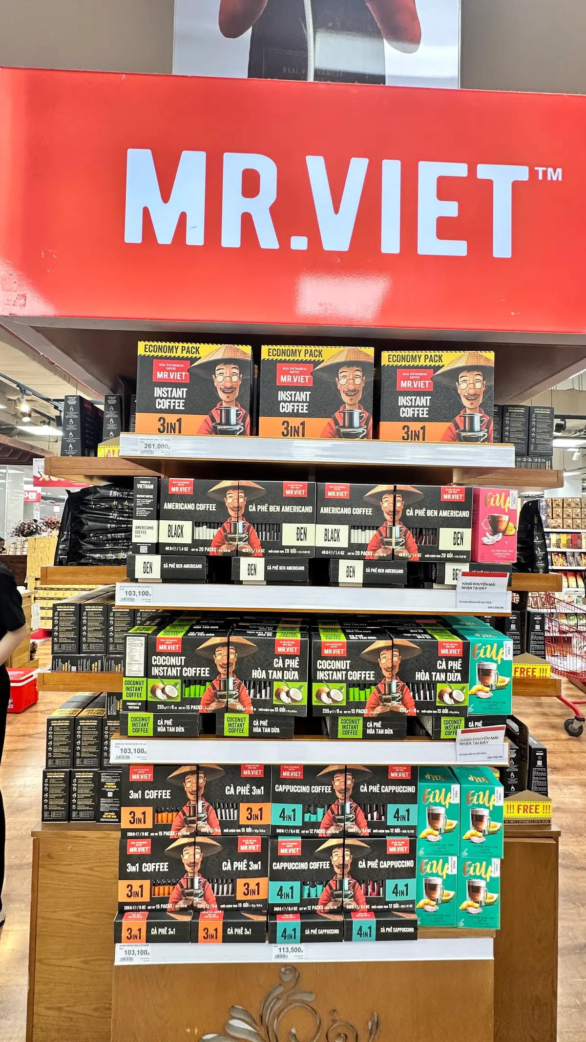 Shelves stocked with boxed instant coffee and packaged imported food products